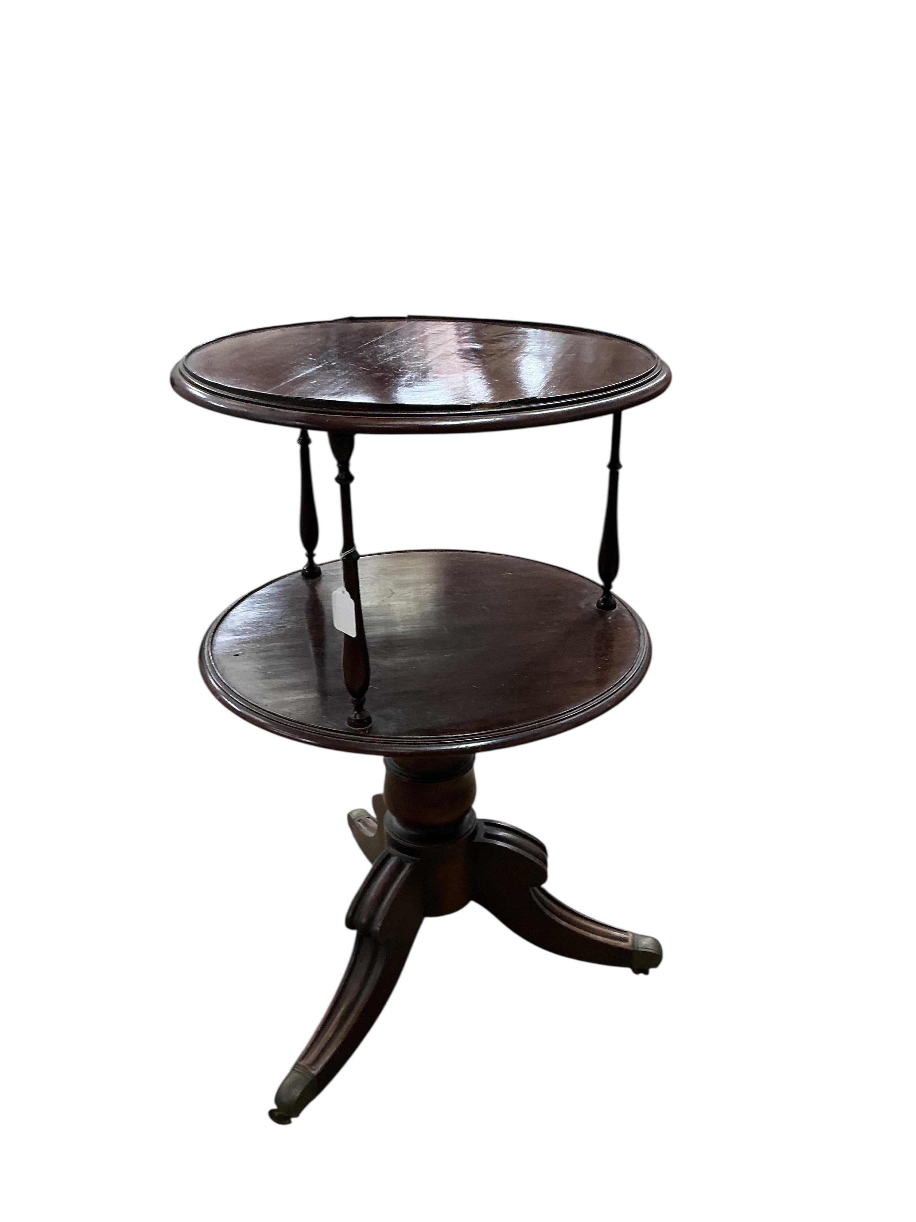 An early 20th century circular mahogany two tier whatnot, diameter 60cm, height 98cm
